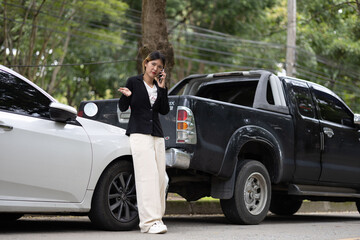 A damaged car on the road after a crash, showing collision impact, danger, injury risk, insurance loss, destruction, and emergency aftermath.
