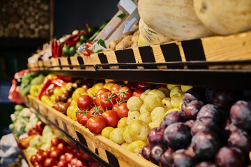 Fresh local produce displayed in a vibrant farmers market grocery store setting