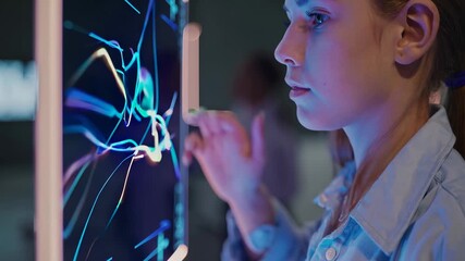 Girl closely examines digital screen analyzing data graph with technology touch exploring interactive charts showing child learning data future technology graph trends through modern interactive scene - Powered by Adobe