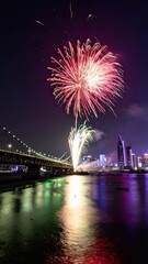 Spectacular Fireworks Display Celebrating Nightlife Over City River, Urban Landscape, Colorful Reflections, Festive Atmosphere