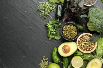 Superfood. Healthy food products on black table, flat lay. Space for text