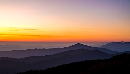 Fototapeta premium Colorful sunrise over a mountain range.