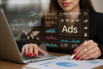 Businesswoman working on laptop with futuristic digital dashboard showing ads, charts, and analytics. Concept of digital marketing, online advertising, and modern business data analysis.