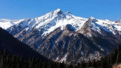 Snowcapped Mountain Summit with Glacier Against Blue Sky - Eternal Alpine Majesty