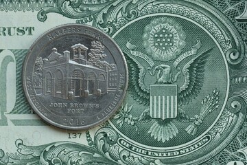American cent coin on dollar bill close up. United States currency