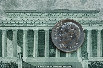 American cent coin on dollar bill close up. United States currency