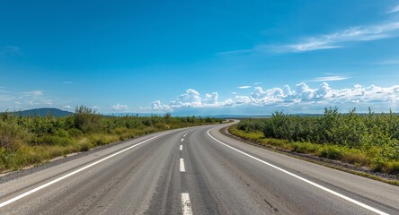 Road Trip Under a Clear Blue Sky With Scenic Clouds and Lush Greenery Views