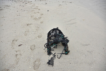 Abandoned Lobster Pot Sitting on a Beach