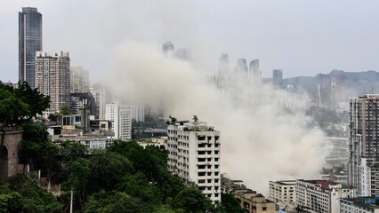 Misty fog burst through Chongqing city skyline creating dramatic urban landscape memories in China station district