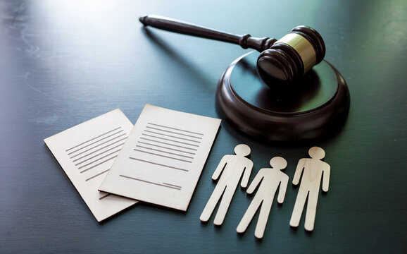 Class action lawsuit and civil rights litigation concept, with a judge's gavel, legal documents, and human figures representing collective justice.
