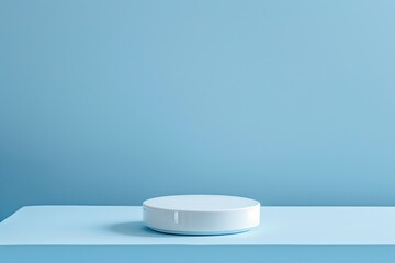 Minimalist plain blue background for product photography with just one white round pedestal in the foreground, emphasizing color contrast and simplicity