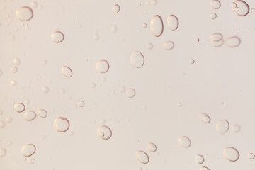 Liquid translucent gray moisturizer serum gel cosmetic smudge background 