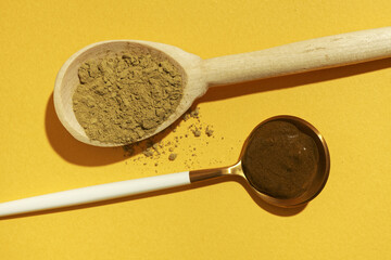 Beauty herbal product sample of red henna dry powder in one spoon and creamy wet henna on honey...