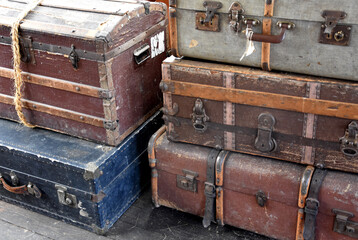 Old Fashioned Suitcases and Chests Stacked Up