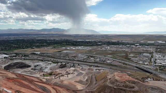 Scenic drone view featuring terrain near the highway under construction on a clear blue sky weather
