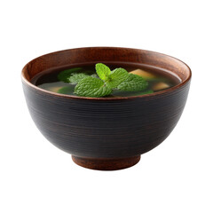 A beautifully crafted wooden bowl filled with delicious broth and fresh green herbs, accented with a sprig of mint, ideal for culinary presentations or healthy eating themes.