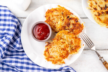 Homemade Hashbrown, Potato pancakes, fried crispy grated potato patties. Traditional dish of American, German cuisine. ideas comfort fall food lunch or brunch, Oktoberfest or Thanksgiving day breakfas