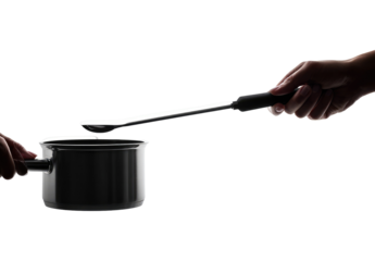 Two hands holding a spatula over a saucepan