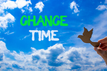 Chance time symbol. Concept word Chance time on beautiful blue sky. Businessman's hand with wooden...