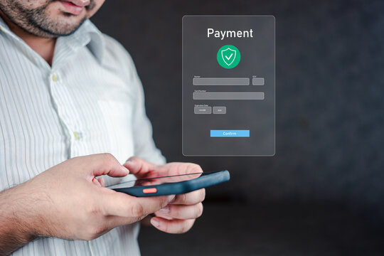 Man using smartphone with icons on virtual screen, online shopping and payment via mobile banking apps financial technology