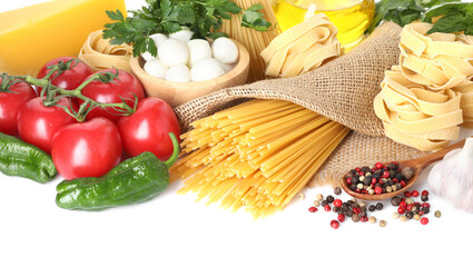 Different types of pasta and ingredients isolated on white