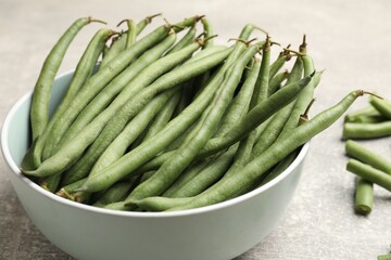 Many raw green beans on grey table, closeup