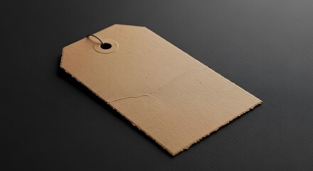 Tan Tag on Black Surface Close Up Showing Hole and Rough Edges