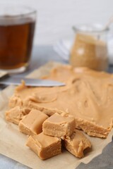 Making candies. Homemade caramel dessert on light table, closeup