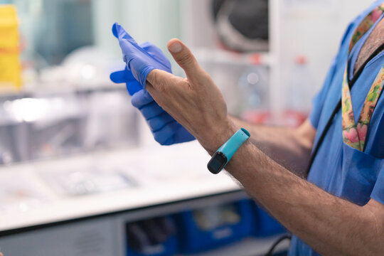 Nurse putting medical syringe and test tubes in plastic bag in hospital or laboratory