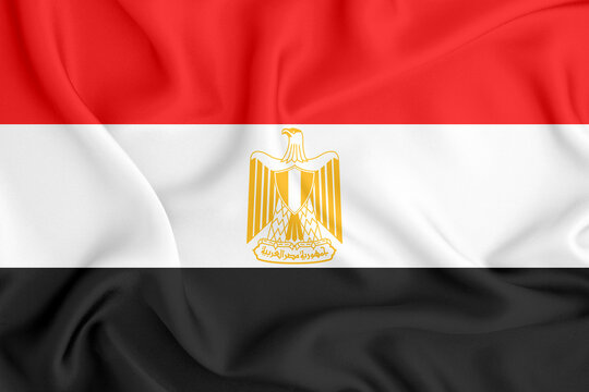 flag of the Arab Republic of Egypt with three horizontal stripes and the coat of arms in the middle on satin fabric with folds and shadows