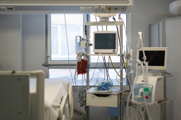 Medical equipment stands ready in modern hospital room