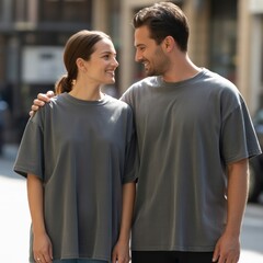 Adult couple double shirt mockup. Young man with woman in oversized short sleeve shirts, jeans, standing in city street. Male and female models in casual tees. Man & woman matching gray shirt mockup