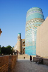 Kalta-minor Minaret and Walled Fortress known as Itchan Kala in Khiva, Uzbekistan -...