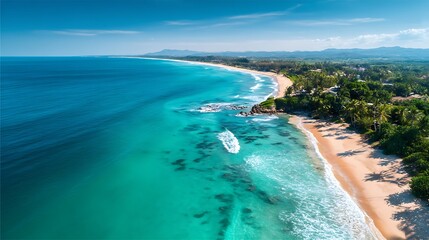 Aerial view of a tropical beach with turquoise waters and sandy shores.