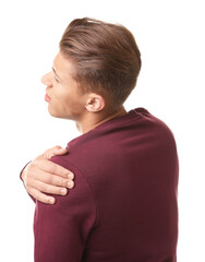 Young man suffering from shoulder pain on white background