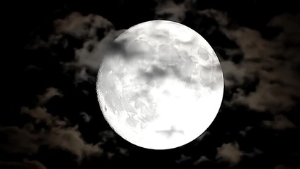 Mesmerising full moonglowing through drifting clouds at night sky  - Powered by Adobe