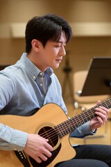Obraz premium Male Music Teacher Adjusting Acoustic Guitar Tuning Peg in Classroom with Soft Natural Light
