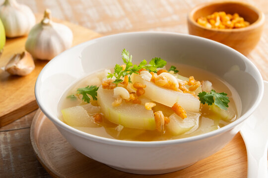 Winter Melon Soup with sun dried shrimp in white bowl.Thai gourd soup is a nutritious and refreshing and low calorie count.