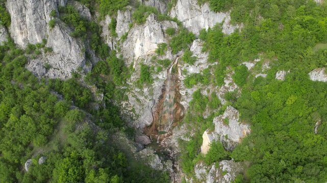 4K aerial drone video flying over mountain valley with waterfall in Durmitor Montenegro
