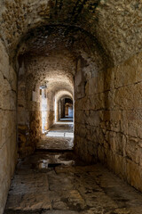 Obraz premium Corridor with Arched Ceiling in the Roman Amphitheatre of Italica at Santiponce near Seville, Spain