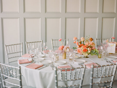 Elegant table setting with floral arrangement and fine dining utensils for a special event in a luxurious venue