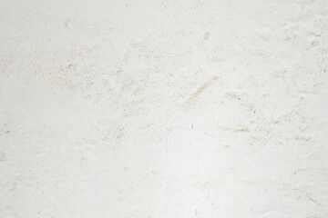 White painted wall with subtle stains and texture
