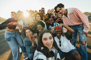 Group of young adults standing outdoors expressing unity and positivity