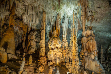 Postojna cave illuminated stalagmites and stalactites
