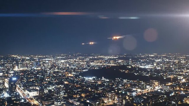 Futuristic hyperloop train streaks through city lights at incredible speed, showcasing advanced transportation technology and urban night travel.