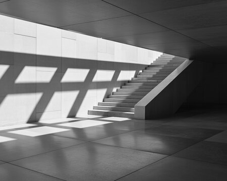 Concrete staircase with dramatic light and shadow patterns