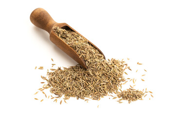 Cumin seeds on wooden spoon isolated on white background. Cuminum cyminum