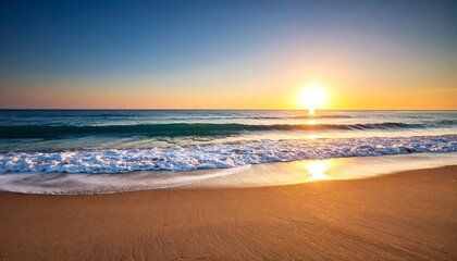 Obraz premium Sunrise over a sandy beach