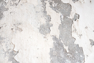 Old Wall damaged with blown Plaster and paint clog, peeling paint damage, water damage on building wall. Grunge abstract background