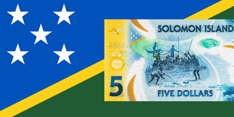 5 Dollars Solomon Islands. Polymer banknote with the image of a man fishing underwater. Money of the Solomon Islands.
